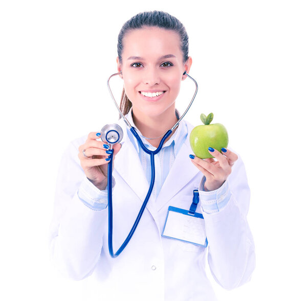 Medical doctor woman examining apple with stethoscope. Woman doctors