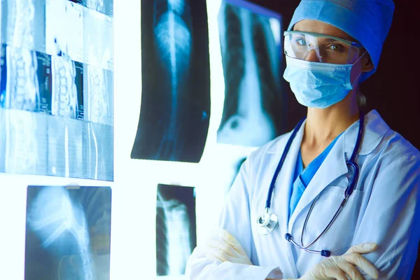 Image of attractive woman doctor looking at x-ray results. — Stock Photo, Image