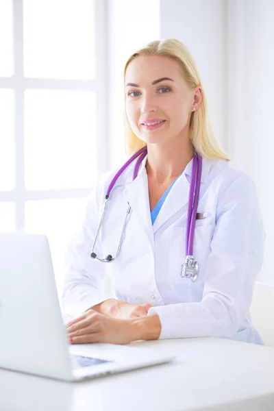 Portrait of a young female doctor in a medical office — Stock Photo, Image