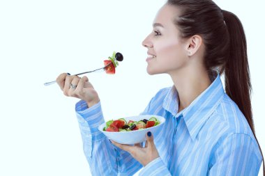 Sağlıklı yemek yiyen güzel bir kız. Güzel kız.