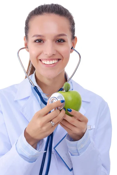 Ärztin untersucht Apfel mit Stethoskop. Ärztinnen — Stockfoto