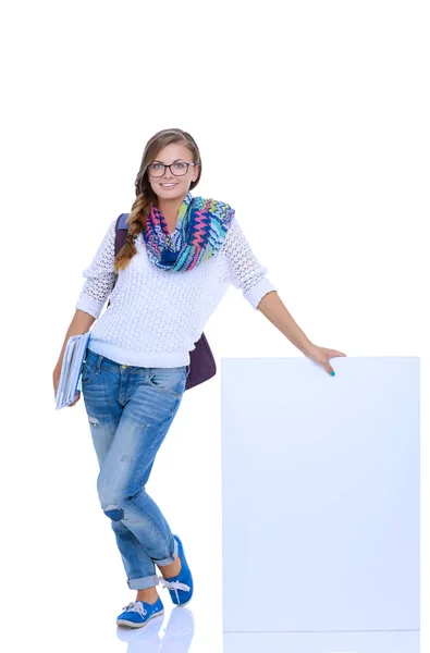 Mooie student woman wijzend op een leeg bord. Student. — Stockfoto