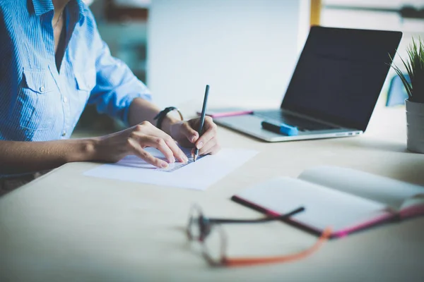 Young woman sitting at office table with laptop. Young woman. Laptop — Stock Photo, Image