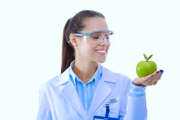 Mulher sorridente doutor com uma maçã verde. Mulher médica — Fotografia de Stock