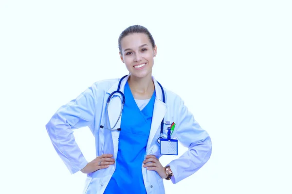 Beautiful young woman in white coat posing with hand in pocket. Woman doctor — Stock Photo, Image