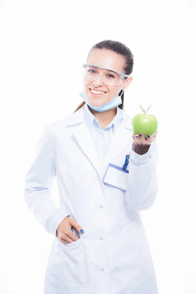 Dentista médico mujer sostiene manzana fresca verde en la mano y cepillo de dientes. Médicos dentistas. Mujeres doctores —  Fotos de Stock