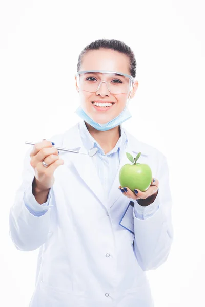 Dentist medical doctor woman hold green fresh apple in hand and tooth brush. Dentist doctors. Woman doctors — Stock Photo, Image