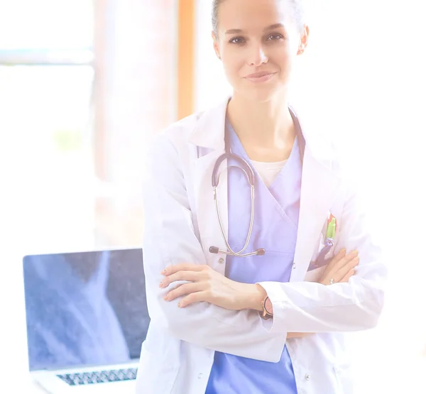 Woman doctor standing with medical stethoscope at hospital — Stock Photo, Image