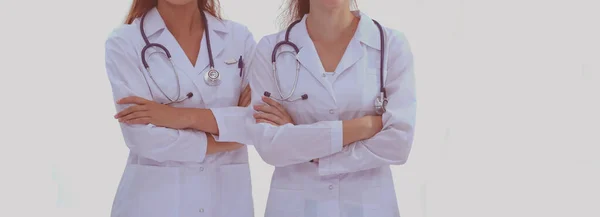 Duas jovens médicas, de pé no hospital. Duas mulheres jovens médico. — Fotografia de Stock