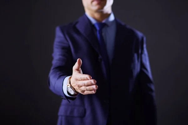 Portrait of a businessman standing with a microphone and looking ahead, speak at the conference — Stock Photo, Image