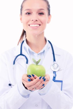 Yeşil elmalı gülümseyen kadın doktor. Kadın doktor
