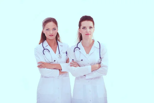 Két fiatal doktornő áll a kórházban. Két fiatal doktornő.. — Stock Fotó