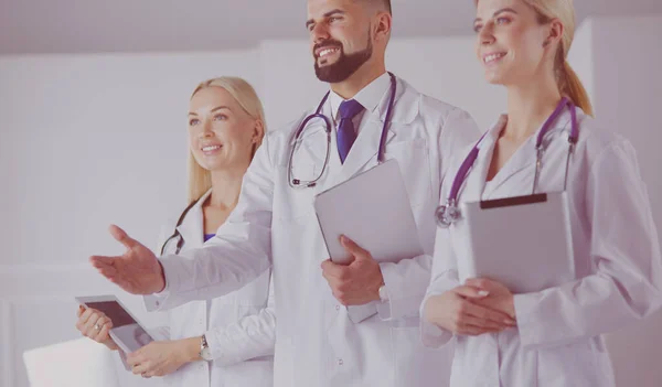 Male doctor offering handshake In Front Of His Colleagues — Stock Photo, Image