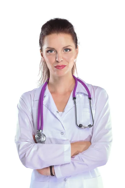 Retrato de una joven doctora con bata blanca de pie en el hospital. Retrato de una joven doctora — Foto de Stock