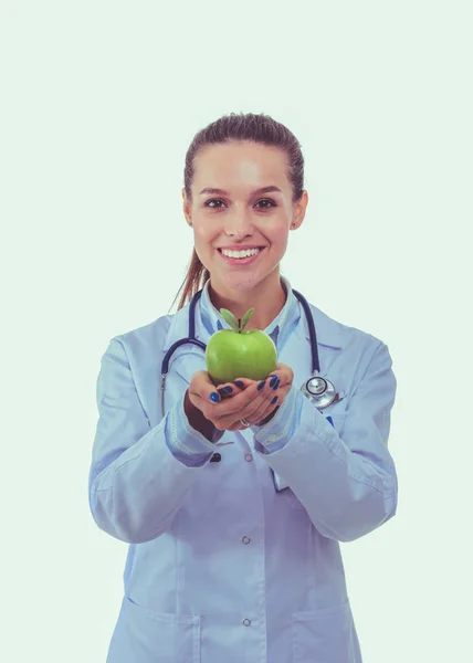 Smiling woman doctor with a green apple. Woman doctor Stock Image