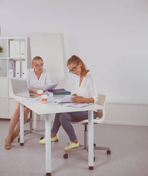 Picture of two smiling businesswomen working in office — Stock Photo, Image