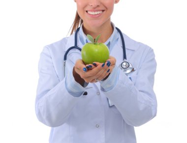 Yeşil elmalı gülümseyen kadın doktor. Kadın doktor