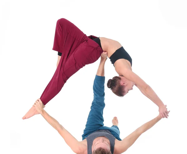 Young athletic couple practicing acroyoga. Balancing in pair. — Stock Photo, Image