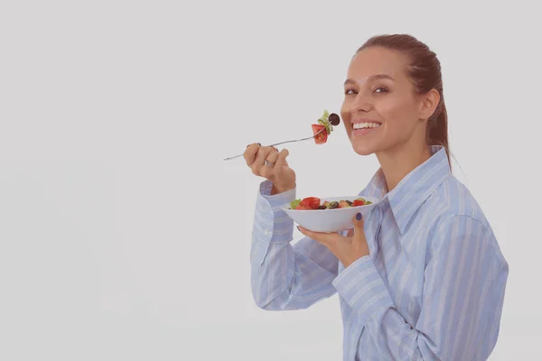 Uma linda garota comendo comida saudável. Menina bonita — Fotografia de Stock