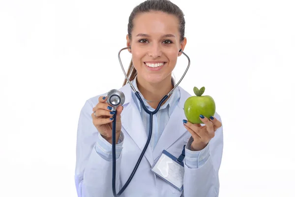 Medical doctor woman examining apple with stethoscope. Woman doctors Stock Picture