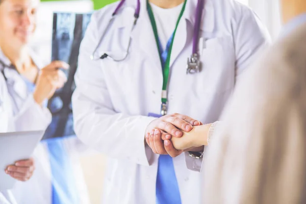 Doctors using a tablet in hospital standing in office — 스톡 사진