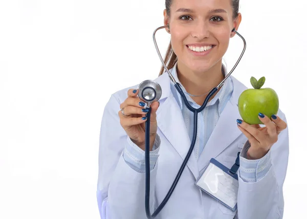 Lekarka badająca jabłko stetoskopem. Lekarki — Zdjęcie stockowe