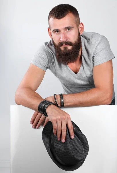 Young man leaning on the empty board — Stock Photo, Image