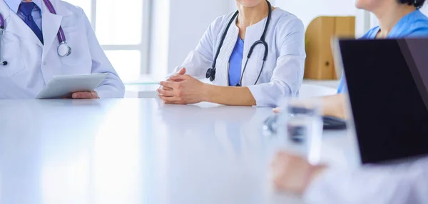 Serious medical team discussing patients case in a bright office — Stock Photo, Image