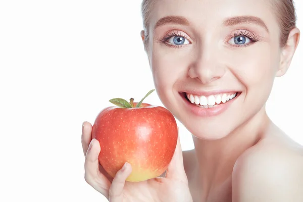 Cute young lady holding red apple while isolated on white background — Stock Photo, Image