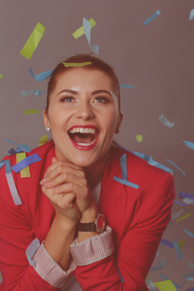 Portreit beautiful happy woman at celebration party with confetti .Birthday or New Year eve celebrating concept.