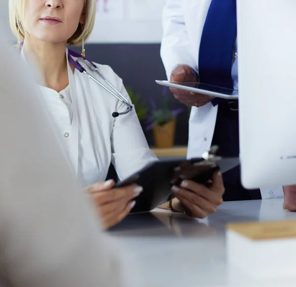 Doctor and nurse working in office at hospital — Stock Photo, Image