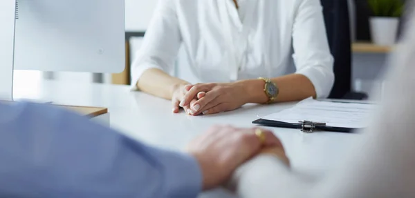 Couple talking to medical specialist, sitting at doctors office — Stock Photo, Image