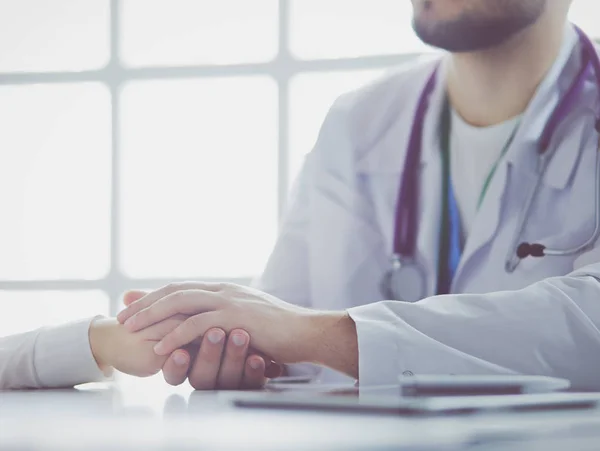 Close-up of stethoscope and paper on background of doctor and patient hands — Stock Photo, Image