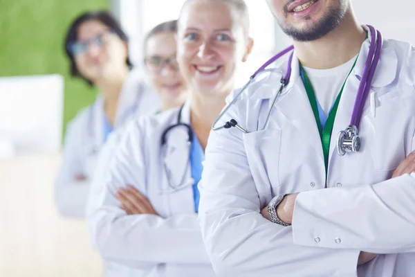 Group of doctors and nurses standing in the hospital room — Stock Photo, Image
