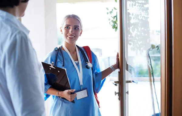 Doctor meeting with patient in hospital office