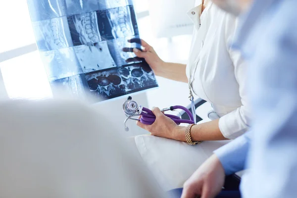 Medical doctor looking at a x-ray image in the office — Stock Photo, Image