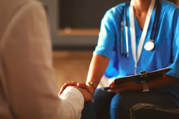 Female doctor shaking a hand in her office — Stock Photo, Image