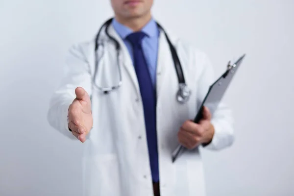 Friendly male doctor with open hand ready for hugging — Stock Photo, Image
