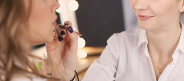 Beautiful young model woman getting fashion make-up — Stock Photo, Image