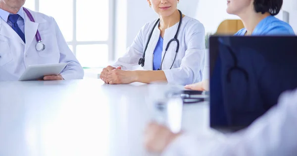 Serious medical team discussing patients case in a bright office — Stock Photo, Image