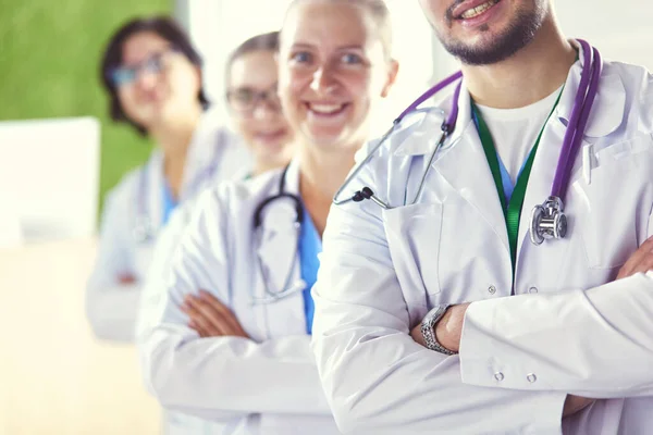 Group of doctors and nurses standing in the hospital room — Stock Photo, Image