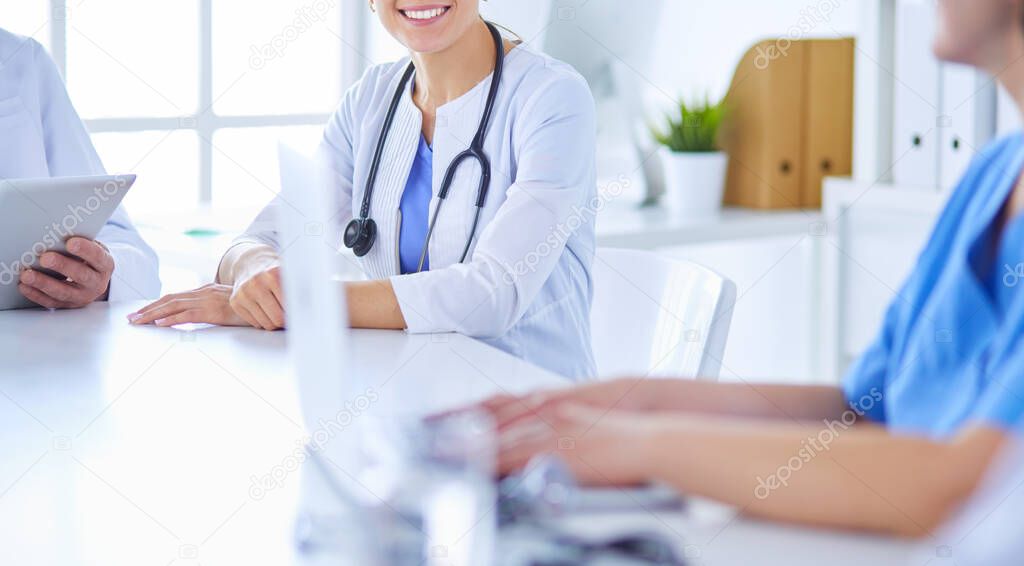 Doctors consulting with each other in a hospital conference room