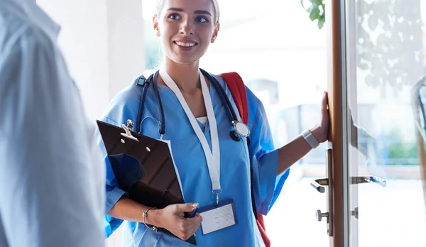 Doctor meeting with patient in hospital office