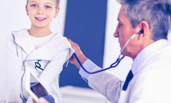 Girl and doctor with stethoscope listening to heartbeat — Stock Photo, Image