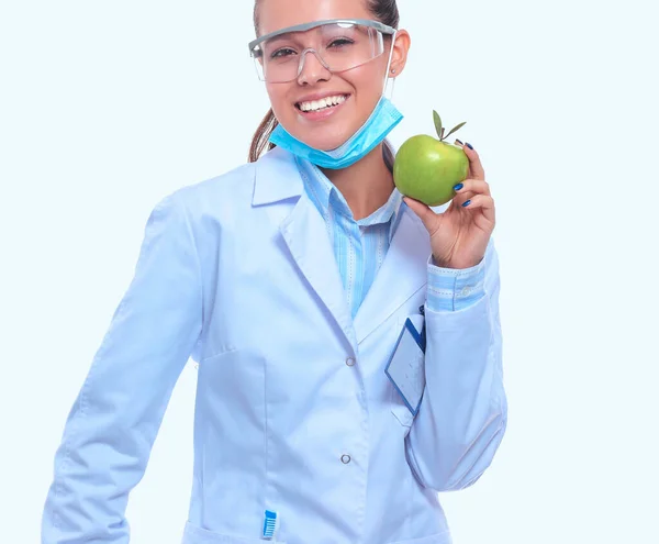 Smiling woman doctor with a green apple — Stock Photo, Image