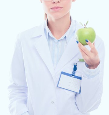 Yeşil elmalı gülümseyen kadın doktor. Kadın doktor