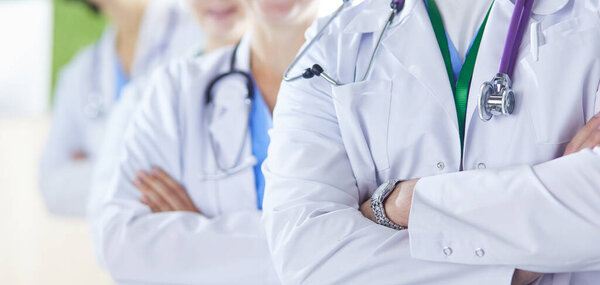 Group of doctors and nurses standing in the hospital room