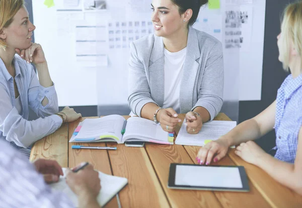 Young people studying with books on desk. Beautiful women and men working together. — Stock Photo, Image