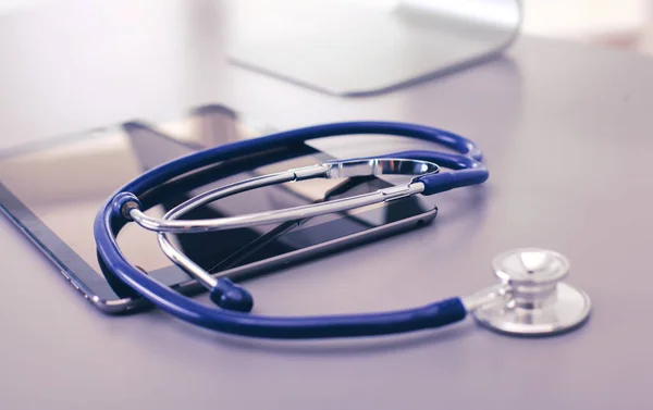 Medical equipment: blue stethoscope and tablet on white background. Medical equipment — Stock Photo, Image