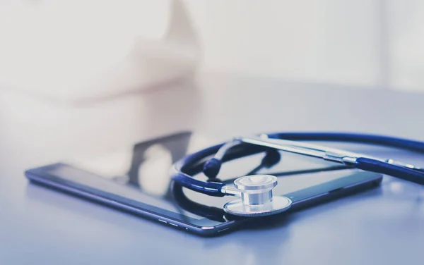 Medical equipment: blue stethoscope and tablet on white background — Stock Photo, Image